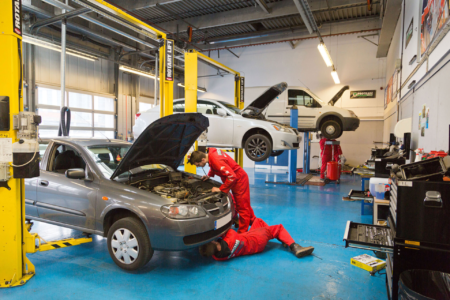 Work Placements with Employers Alt text Students working on cars in a garage workshop